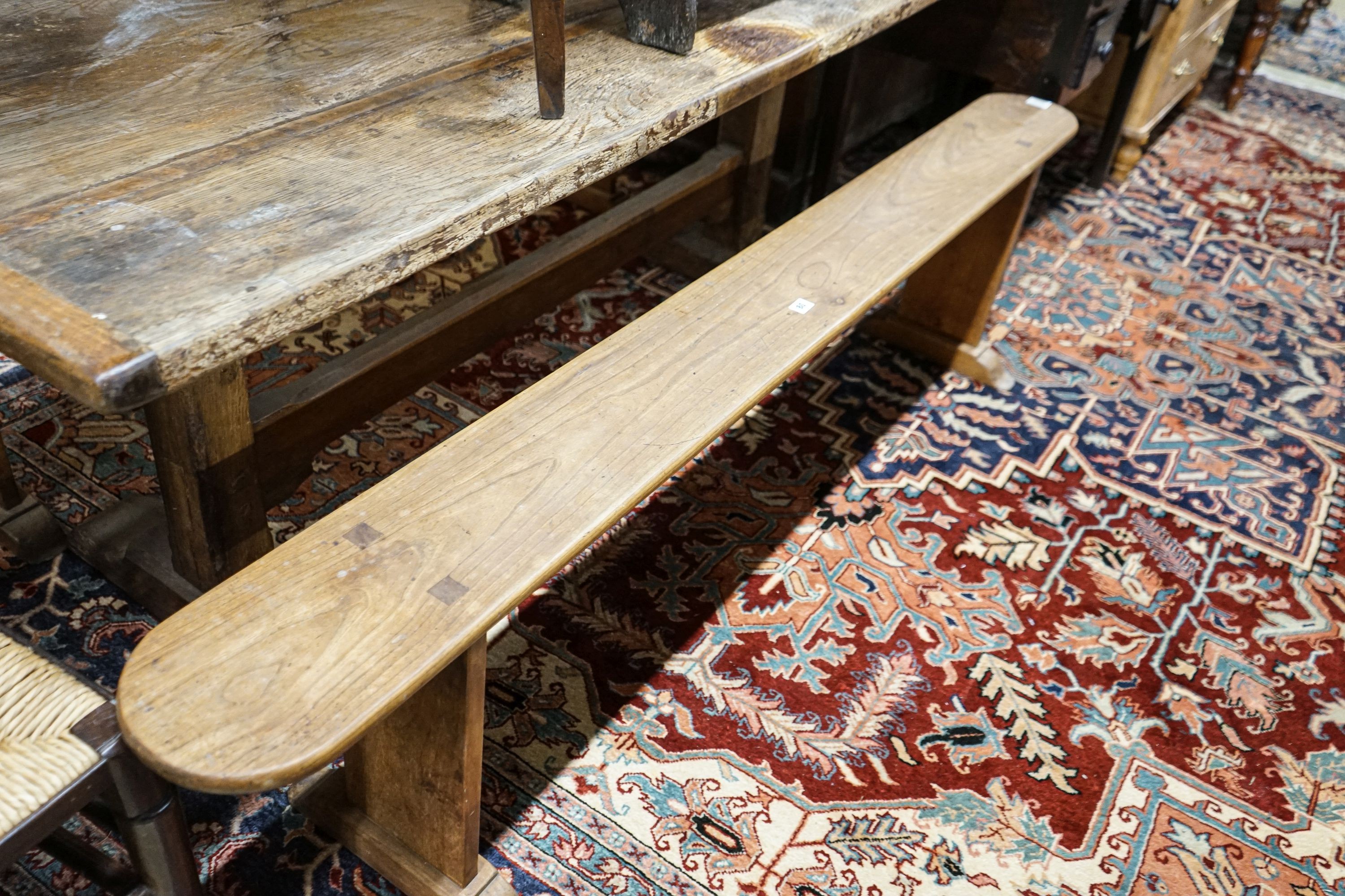 A pair of provincial elm benches, width 199cm, depth 19cm, height 48cm